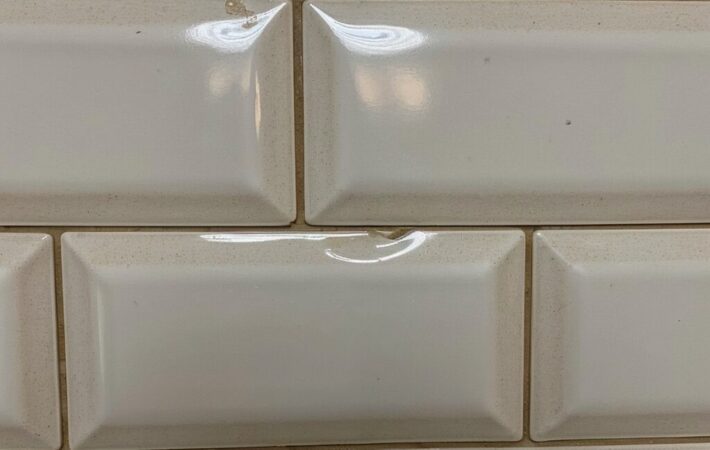 "Clean kitchen backsplash with mold-free sealed joints.